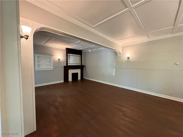 unfurnished living room featuring dark hardwood / wood-style floors, a fireplace, and crown molding