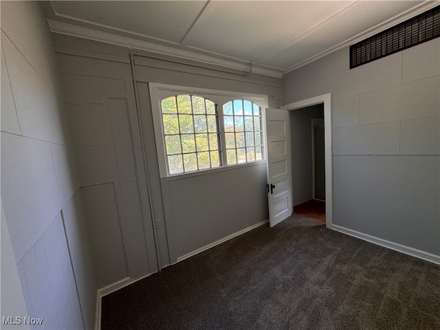 interior space with dark colored carpet