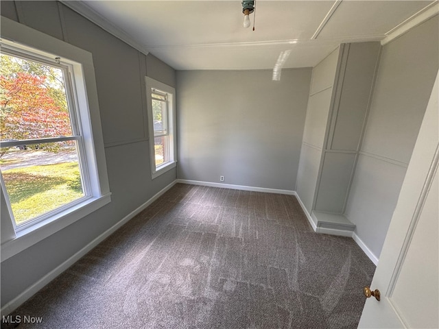 carpeted spare room with ornamental molding