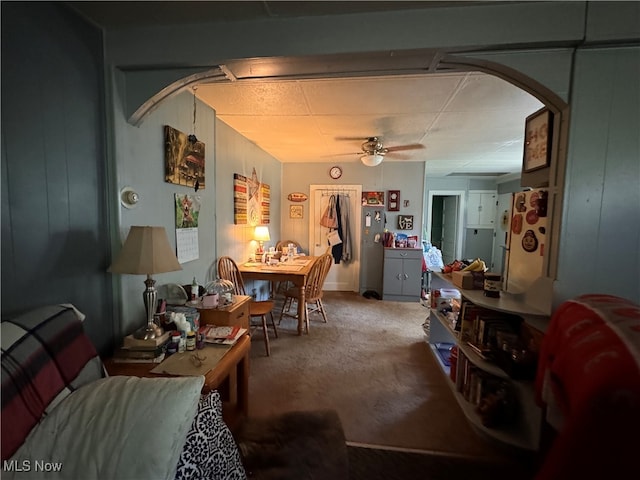 living room featuring ceiling fan and carpet flooring