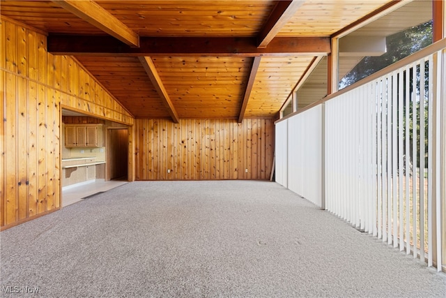 interior space with wood ceiling, vaulted ceiling with beams, and carpet flooring