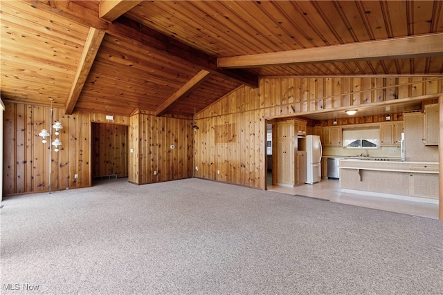 unfurnished living room featuring vaulted ceiling with beams, light colored carpet, and wooden ceiling