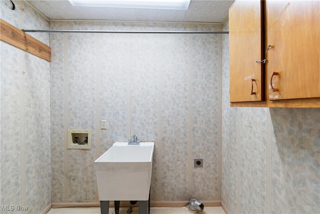 laundry room featuring cabinets, hookup for an electric dryer, washer hookup, and sink