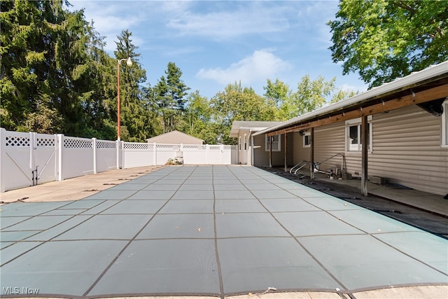 view of swimming pool with a patio area