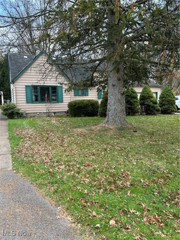 view of home's exterior featuring a yard