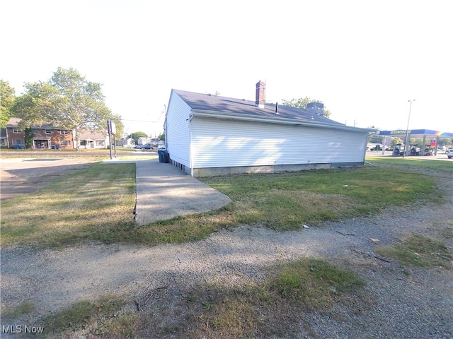 view of home's exterior with a lawn