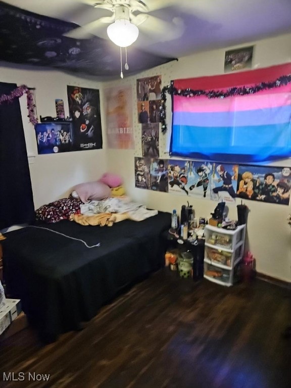 bedroom featuring hardwood / wood-style flooring and ceiling fan