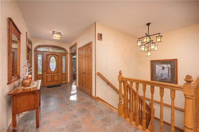 entryway with a notable chandelier