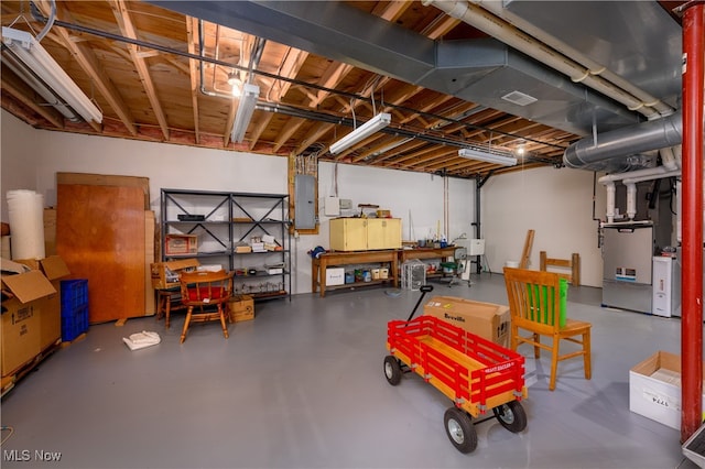 basement featuring electric panel and sink