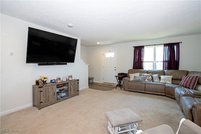 living room featuring light carpet