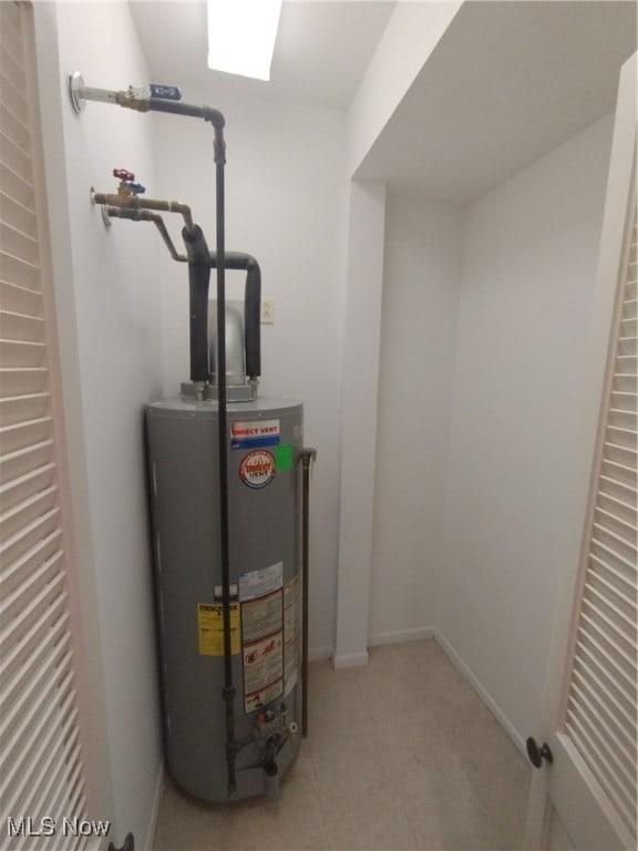 utility room with water heater