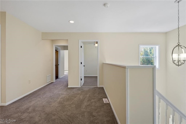 interior space featuring carpet floors and a notable chandelier