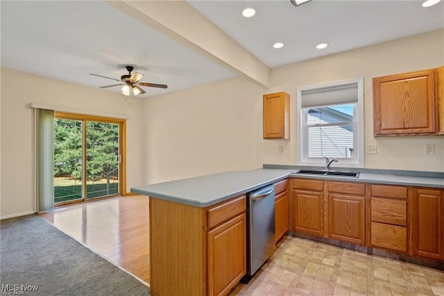 kitchen featuring kitchen peninsula, stainless steel dishwasher, ceiling fan, sink, and light hardwood / wood-style flooring