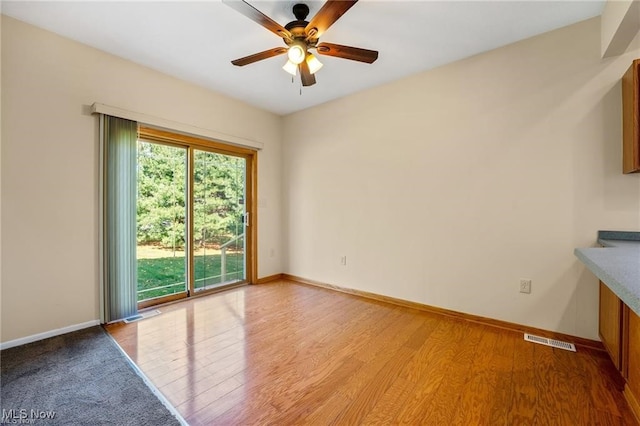 interior space with ceiling fan and light hardwood / wood-style flooring