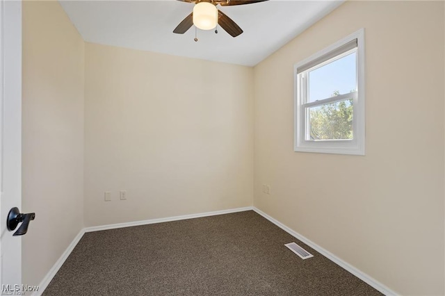 carpeted empty room featuring ceiling fan