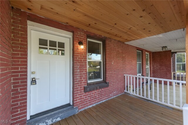 doorway to property with a porch