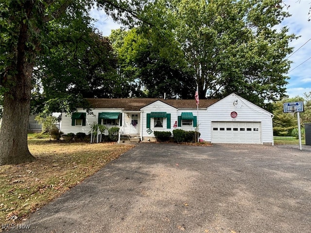 ranch-style home featuring a garage