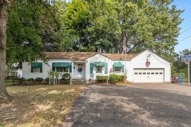 ranch-style house featuring a garage