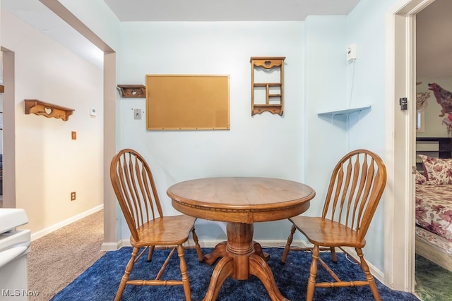 view of carpeted dining space