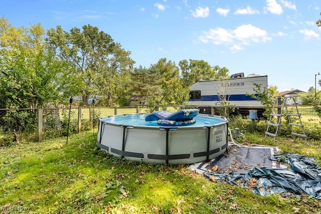 view of yard featuring a fenced in pool