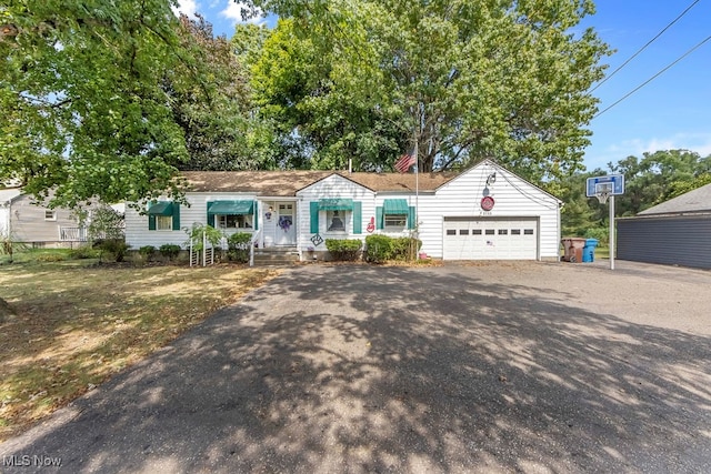 ranch-style house featuring a garage