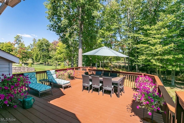 deck with outdoor dining space