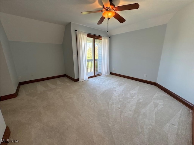 bonus room with ceiling fan, light colored carpet, baseboards, and lofted ceiling