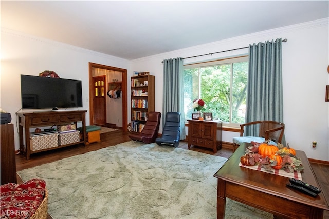 living room with crown molding and hardwood / wood-style floors