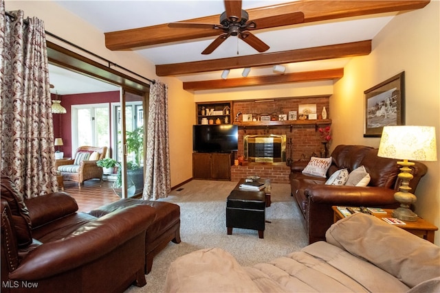 living room featuring ceiling fan, light colored carpet, and beamed ceiling