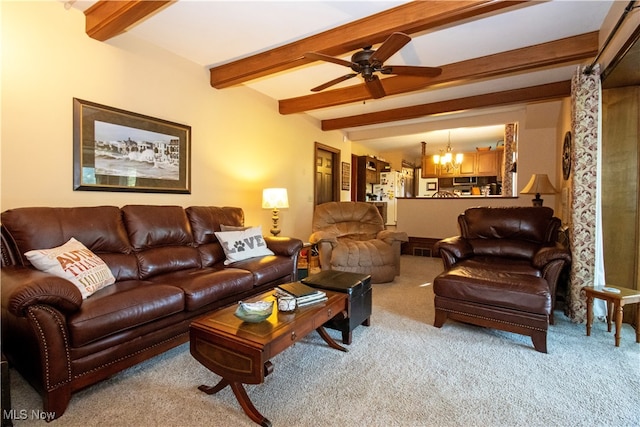 living room with ceiling fan with notable chandelier, beamed ceiling, and light carpet