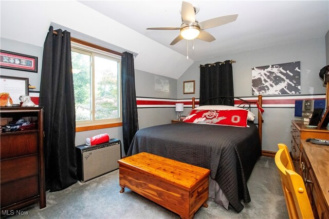 bedroom with vaulted ceiling, ceiling fan, and light colored carpet