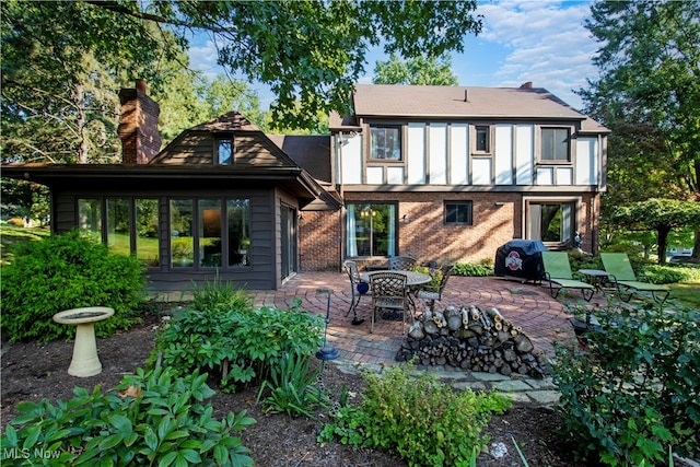 back of property with a patio