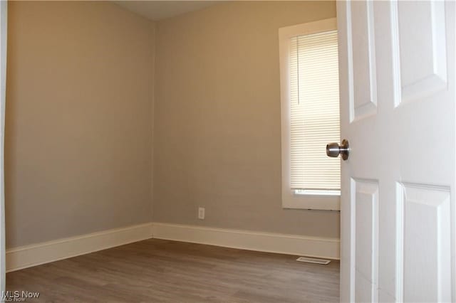 spare room featuring hardwood / wood-style flooring