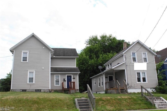 view of front facade with a front yard