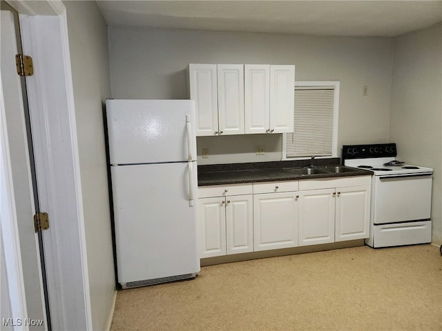 kitchen with light carpet, white cabinetry, white appliances, and sink