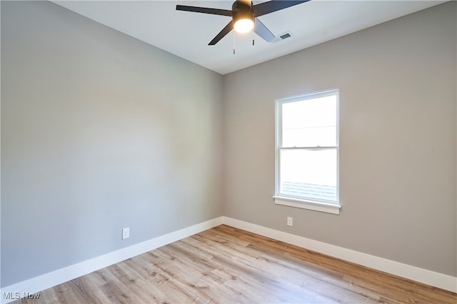 unfurnished room with ceiling fan and light wood-type flooring