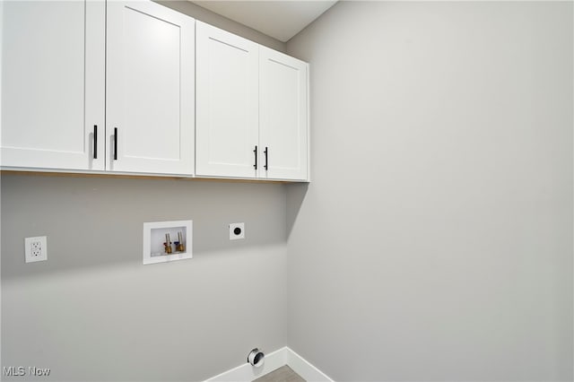 laundry room featuring hookup for a washing machine, cabinets, and electric dryer hookup