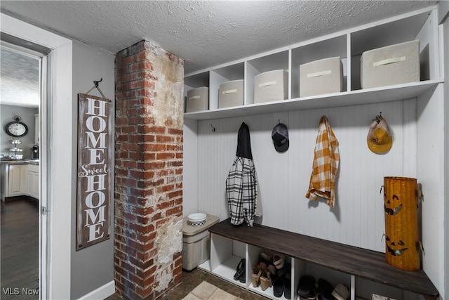 mudroom with a textured ceiling