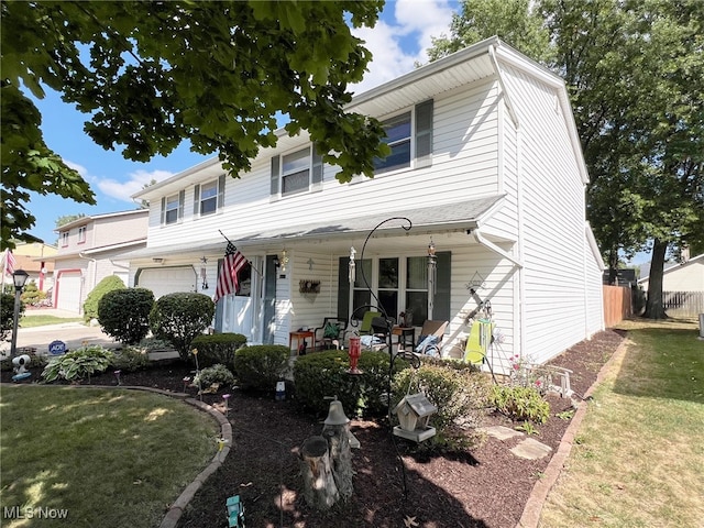 view of front facade featuring a front yard and a garage