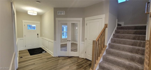 entryway featuring hardwood / wood-style floors and french doors