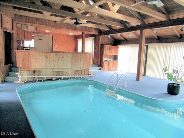 view of pool featuring ceiling fan and a jacuzzi