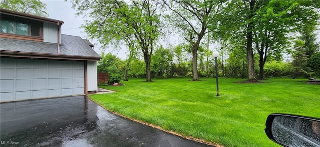 view of yard featuring a garage