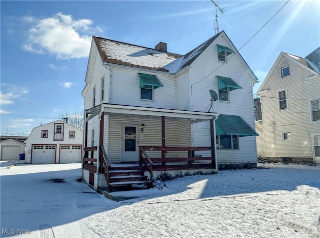 front of property featuring a porch and a garage