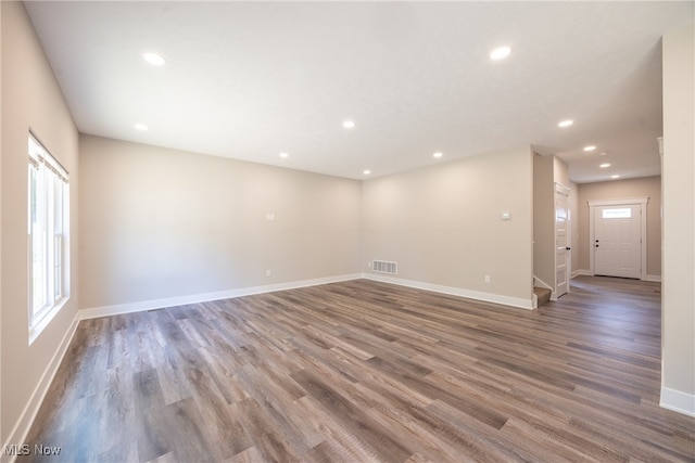 spare room with hardwood / wood-style flooring