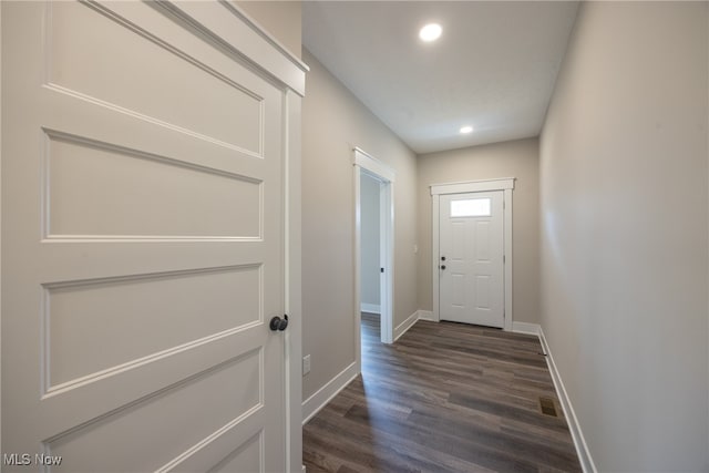 entryway with dark hardwood / wood-style flooring