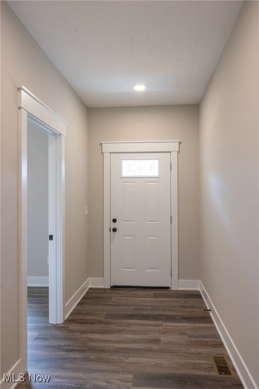 doorway to outside featuring dark hardwood / wood-style floors