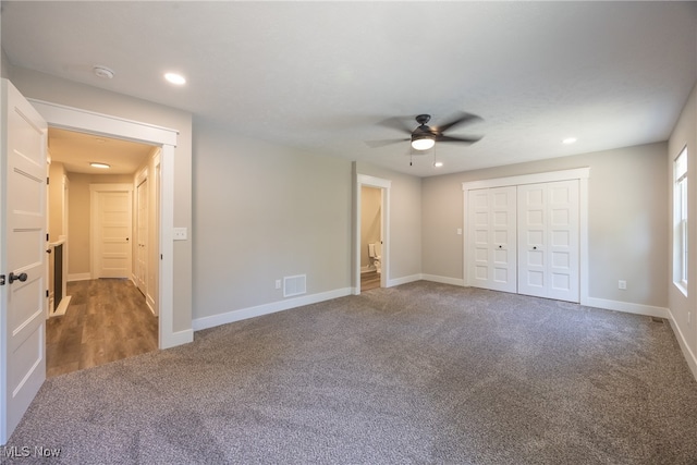 unfurnished bedroom featuring a closet, ceiling fan, and carpet flooring