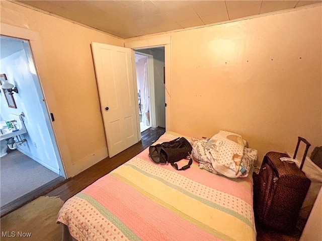 bedroom featuring dark hardwood / wood-style flooring