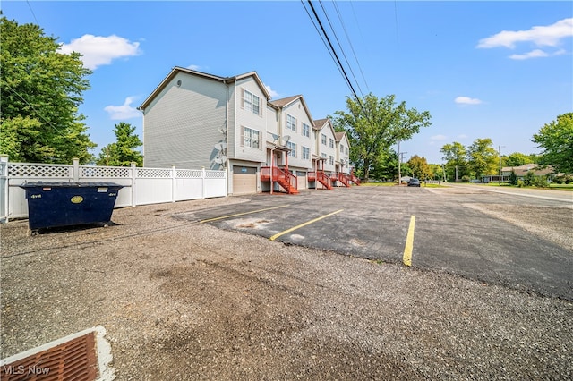 view of car parking featuring a garage