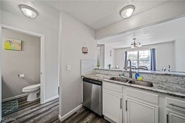 kitchen featuring sink, a notable chandelier, white cabinetry, dark hardwood / wood-style flooring, and stainless steel dishwasher